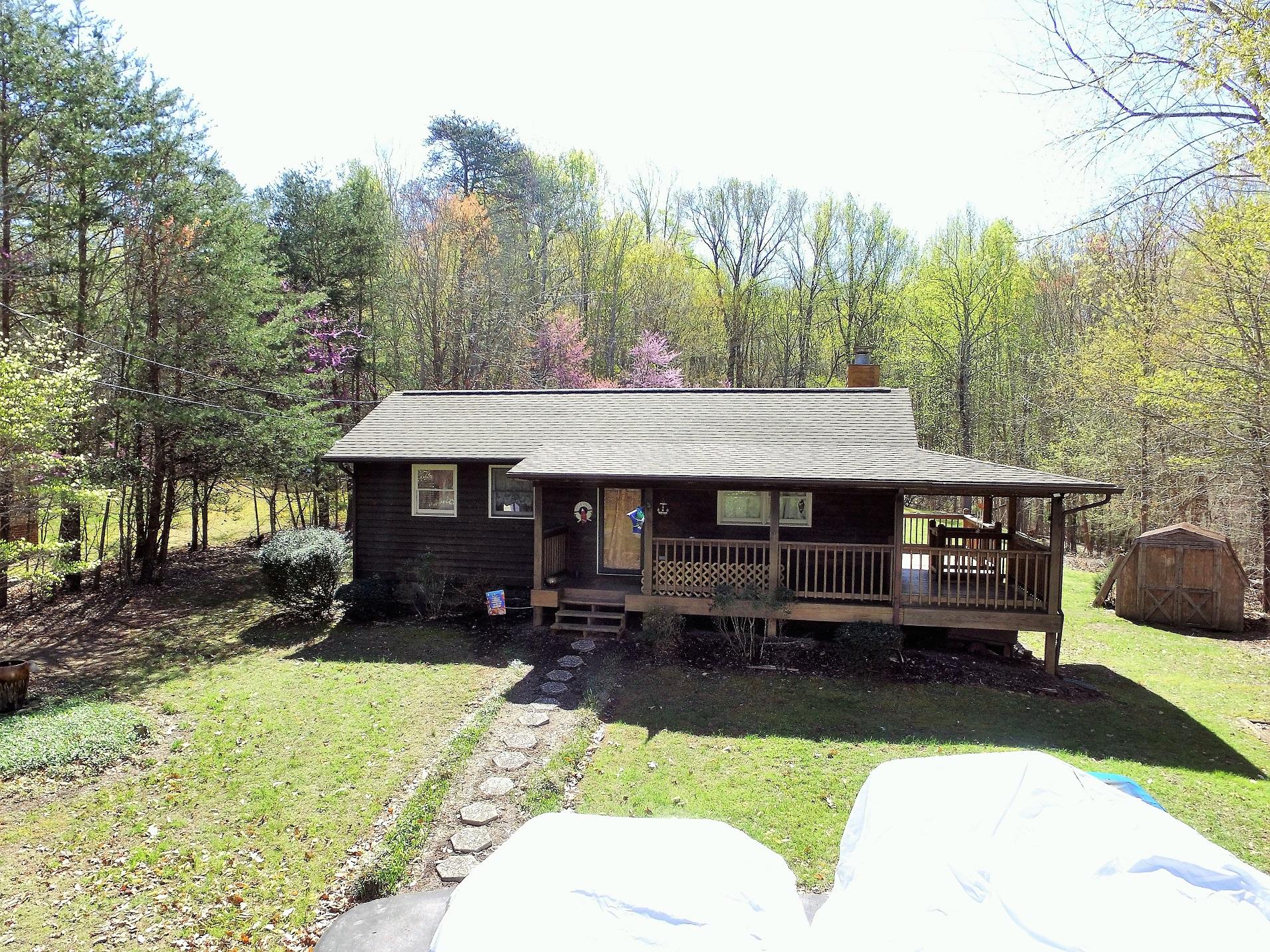 214 Highland Lake Road Union Hall, VA 24176 - Photo 19 of 33 a view of a house with backyard and sitting area