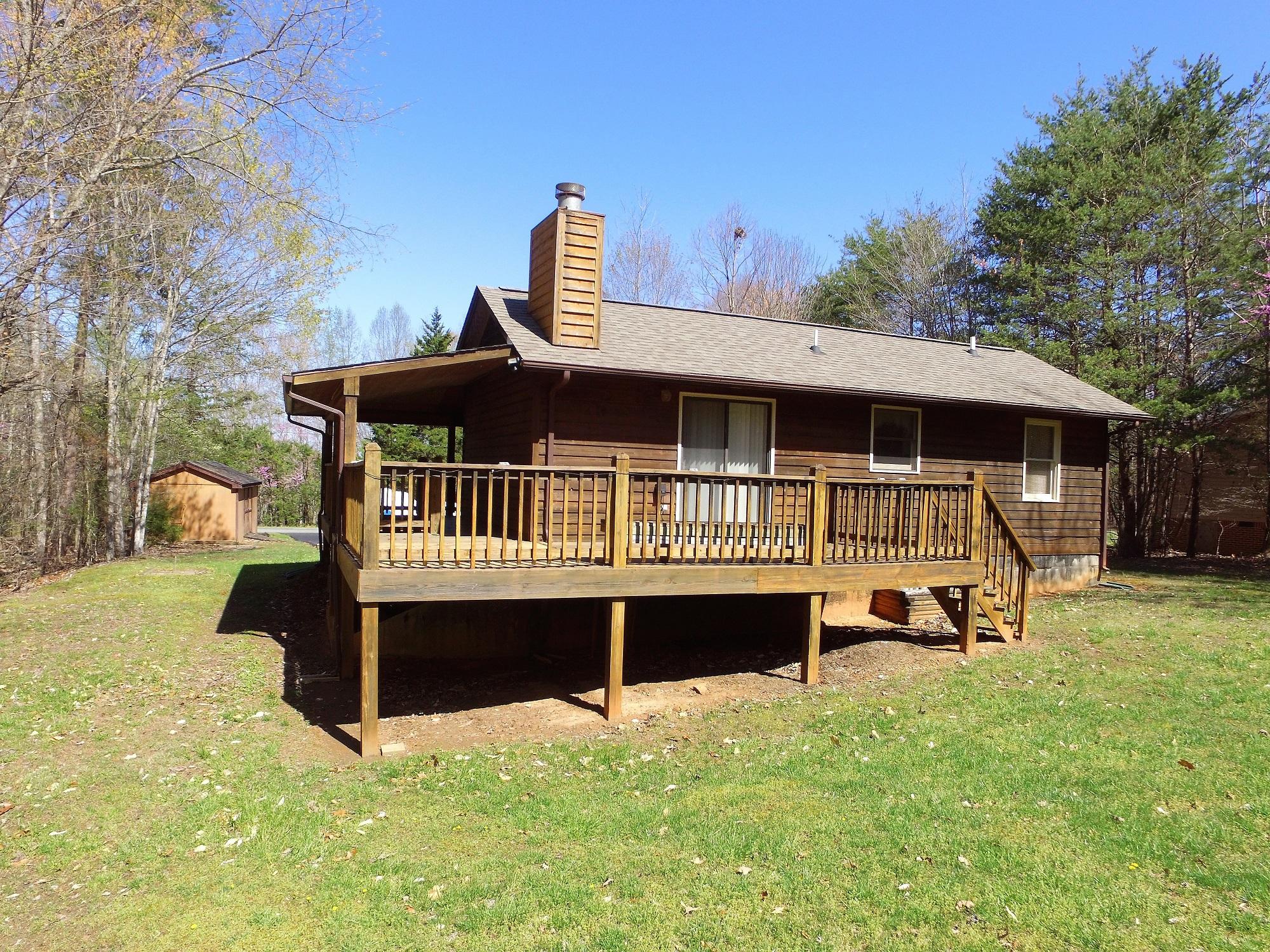 214 Highland Lake Road Union Hall, VA 24176 - Photo 4 of 33 a view of a house with a roof deck