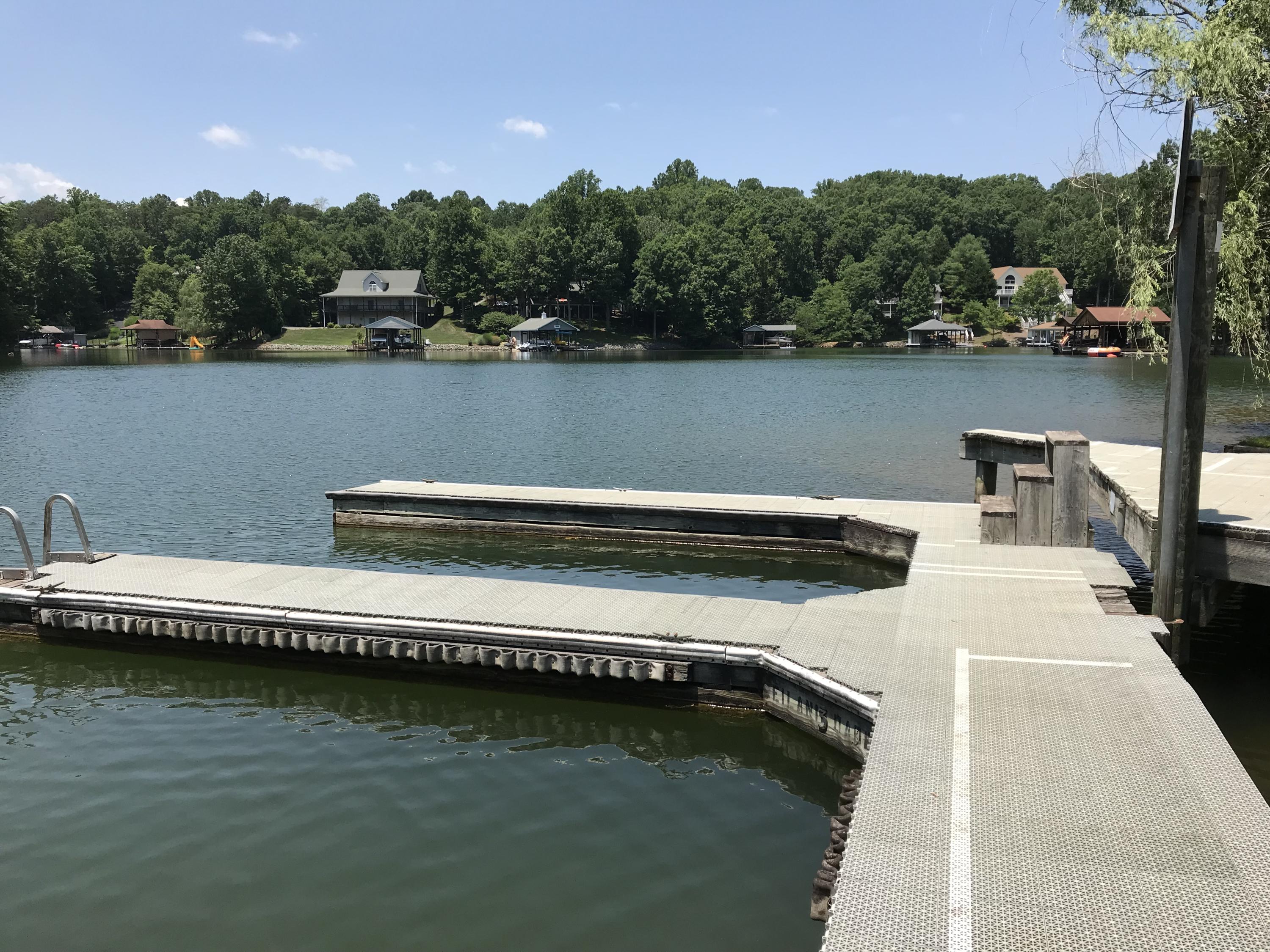 214 Highland Lake Road Union Hall, VA 24176 - Photo 31 of 33 a view of a lake with houses in the back