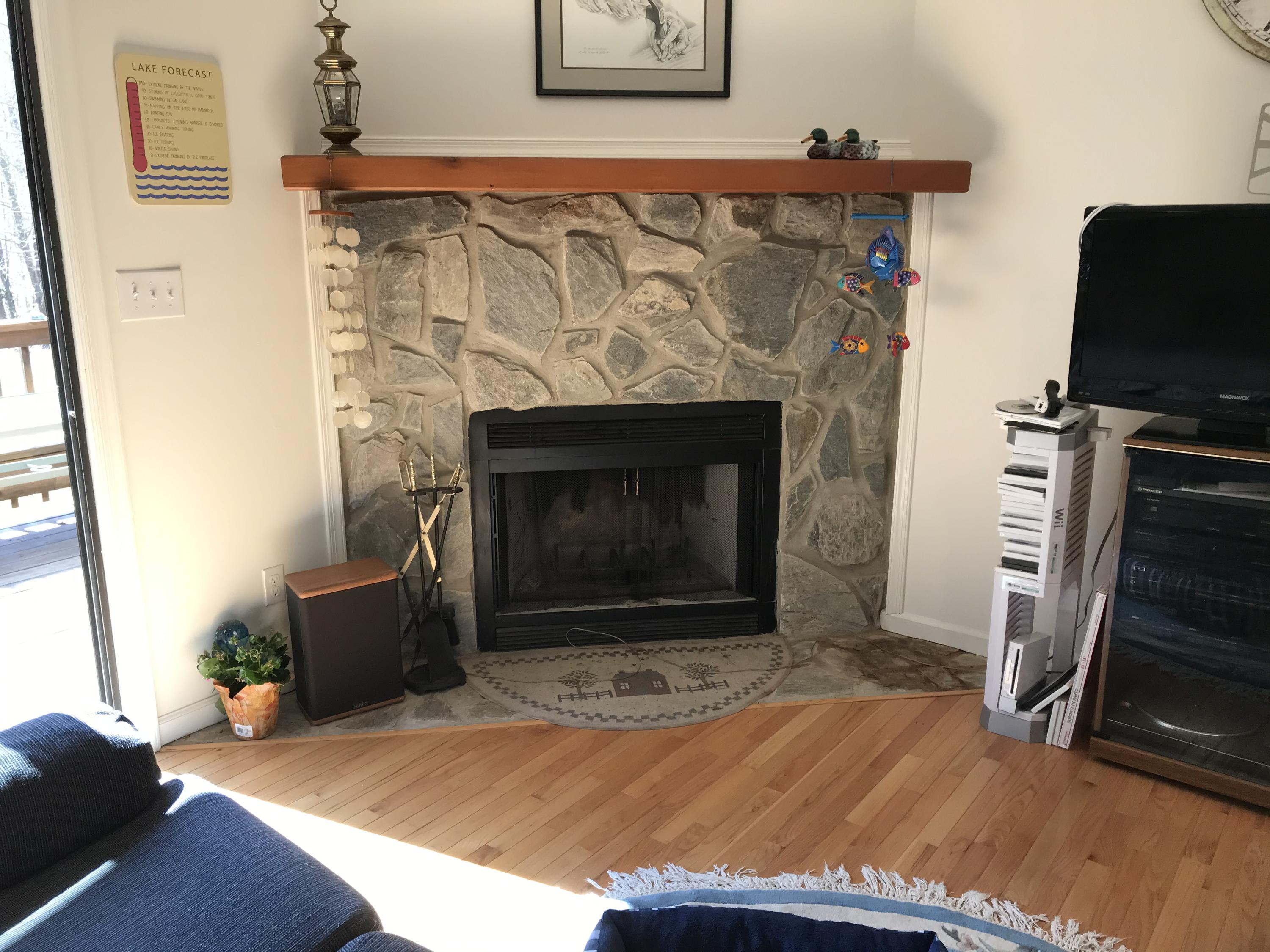 214 Highland Lake Road Union Hall, VA 24176 - Photo 8 of 33 a living room with furniture and a fireplace