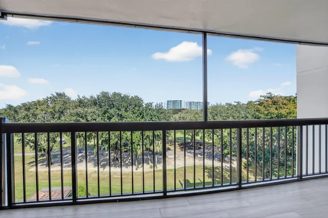 a view of a lake with a yard