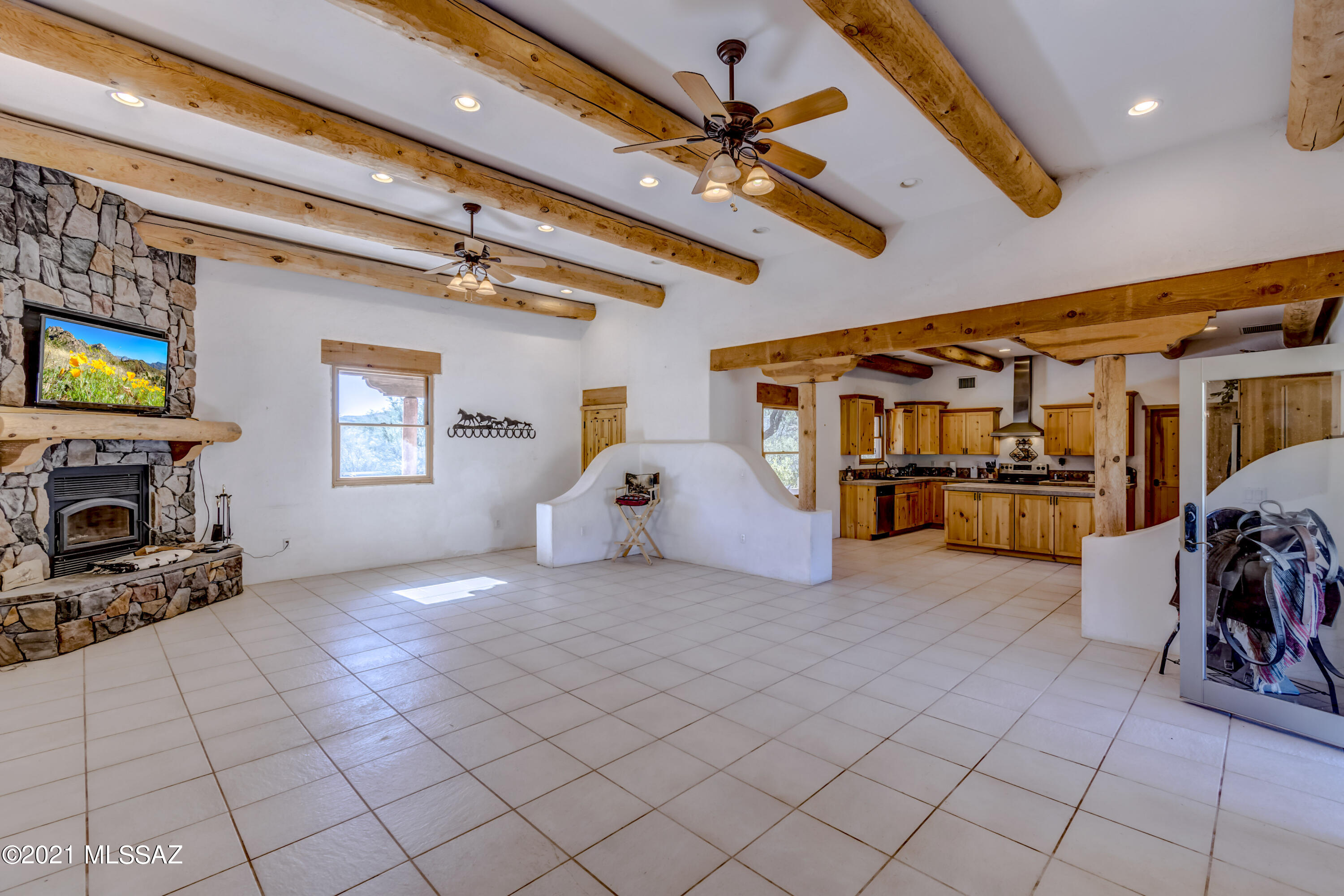 15301 East Hillton Ranch Road Vail, AZ 85641 - Photo 6 of 33 a view of a room with gym equipment and a large window