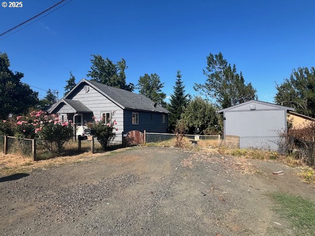 596 East 7th Street Coquille, OR 97423 - Photo 2 of 14 a view of a house with backyard and sitting area