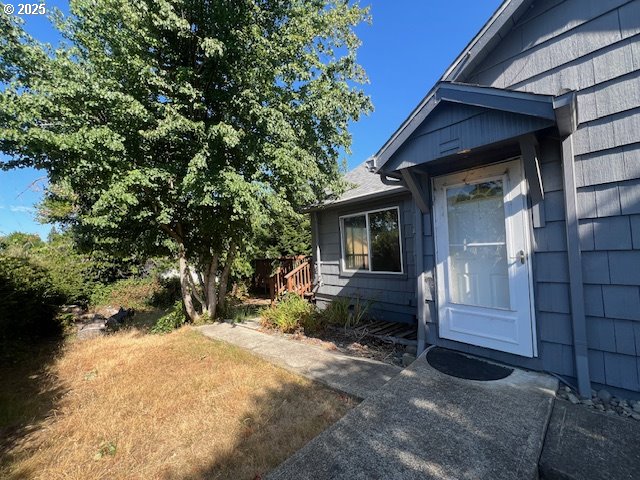 596 East 7th Street Coquille, OR 97423 - Photo 4 of 14 a view of a house with a yard