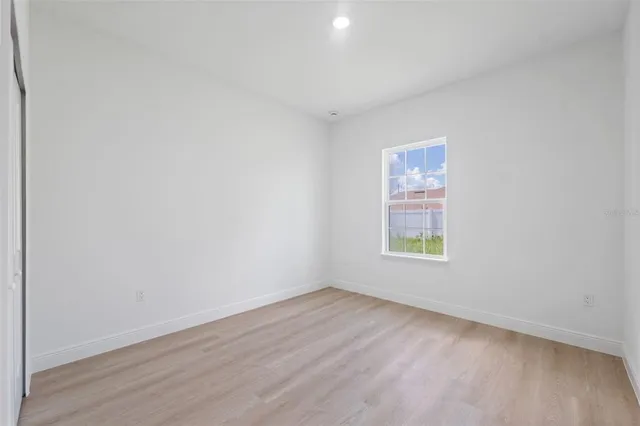 a bathroom with a granite countertop sink a toilet and a bathtub