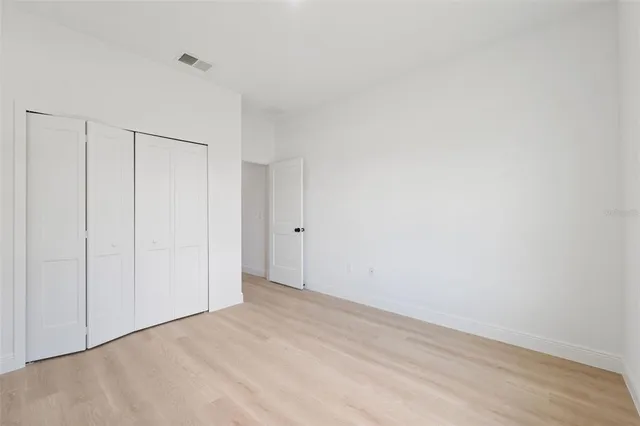 a view of a house with backyard and garden