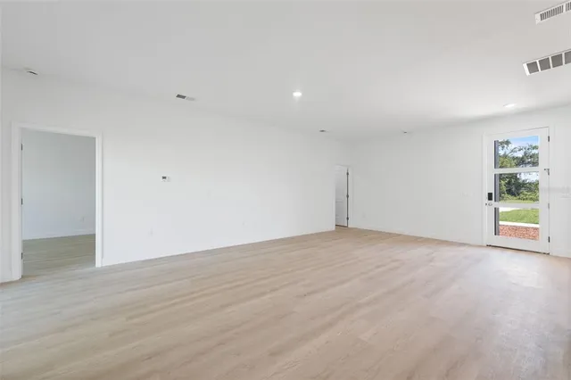 a view of a kitchen with a sink and a window