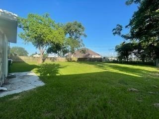 1114 East Pecan Street Angleton, TX 77515 - Photo 19 of 20 a view of a golf course with a garden