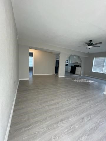 1114 East Pecan Street Angleton, TX 77515 - Photo 5 of 20 a view of a hallway with wooden floor