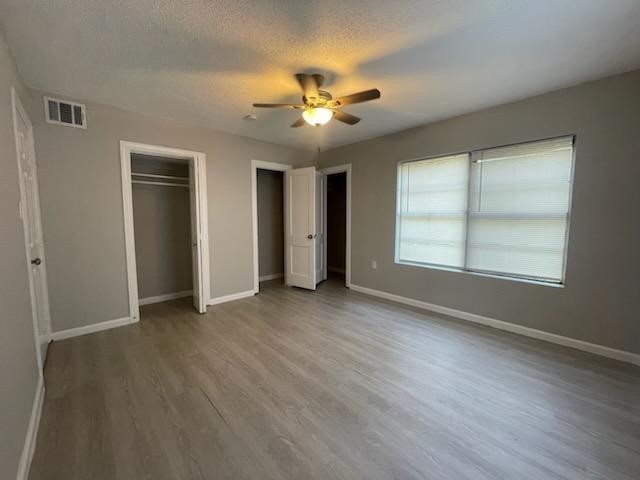 1114 East Pecan Street Angleton, TX 77515 - Photo 10 of 20 a view of an empty room with a window