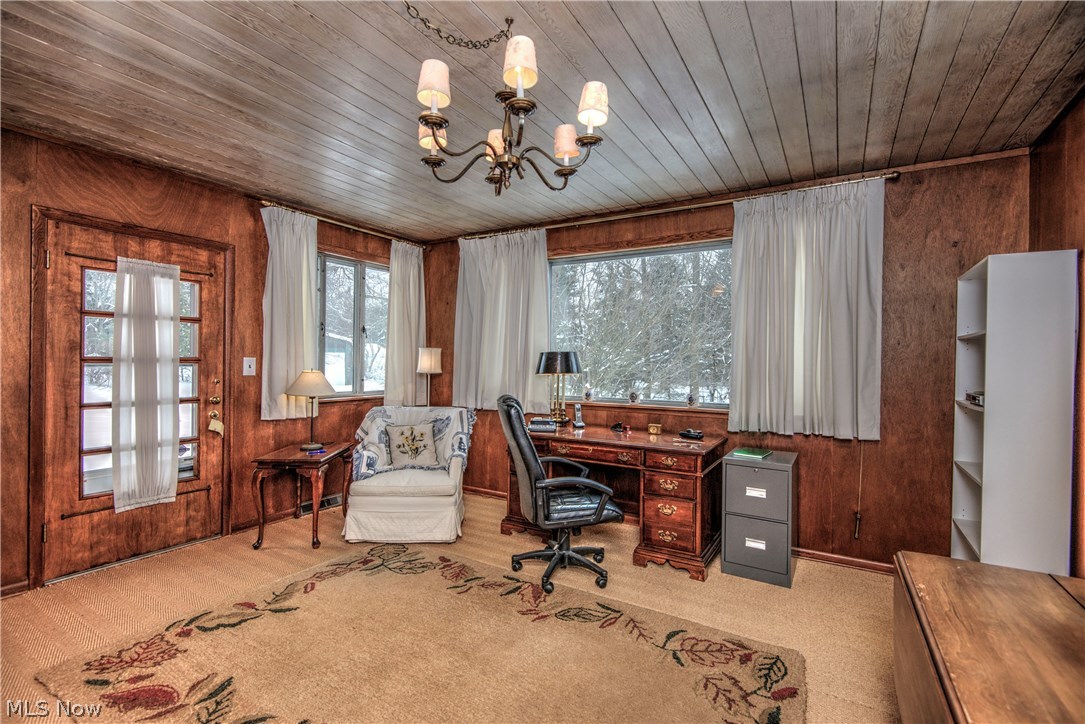 7844 Kinsman Road Novelty, OH 44072 - Photo 5 of 27 Located off the living room, the sun room has been set up as an office.