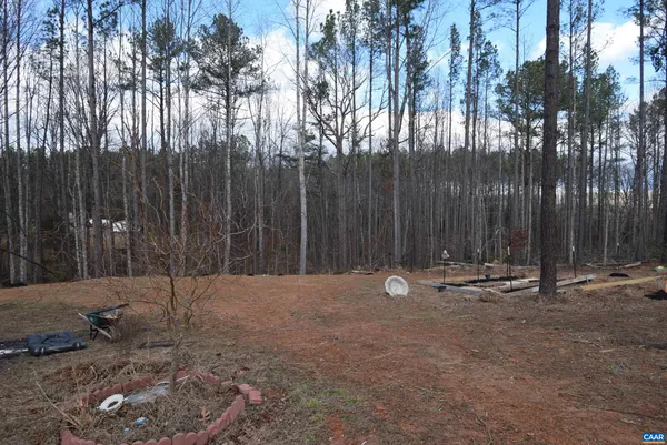 a view of outdoor space with wooden fence
