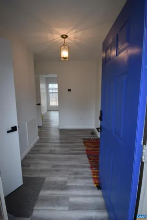 a view of gallery with wooden floor