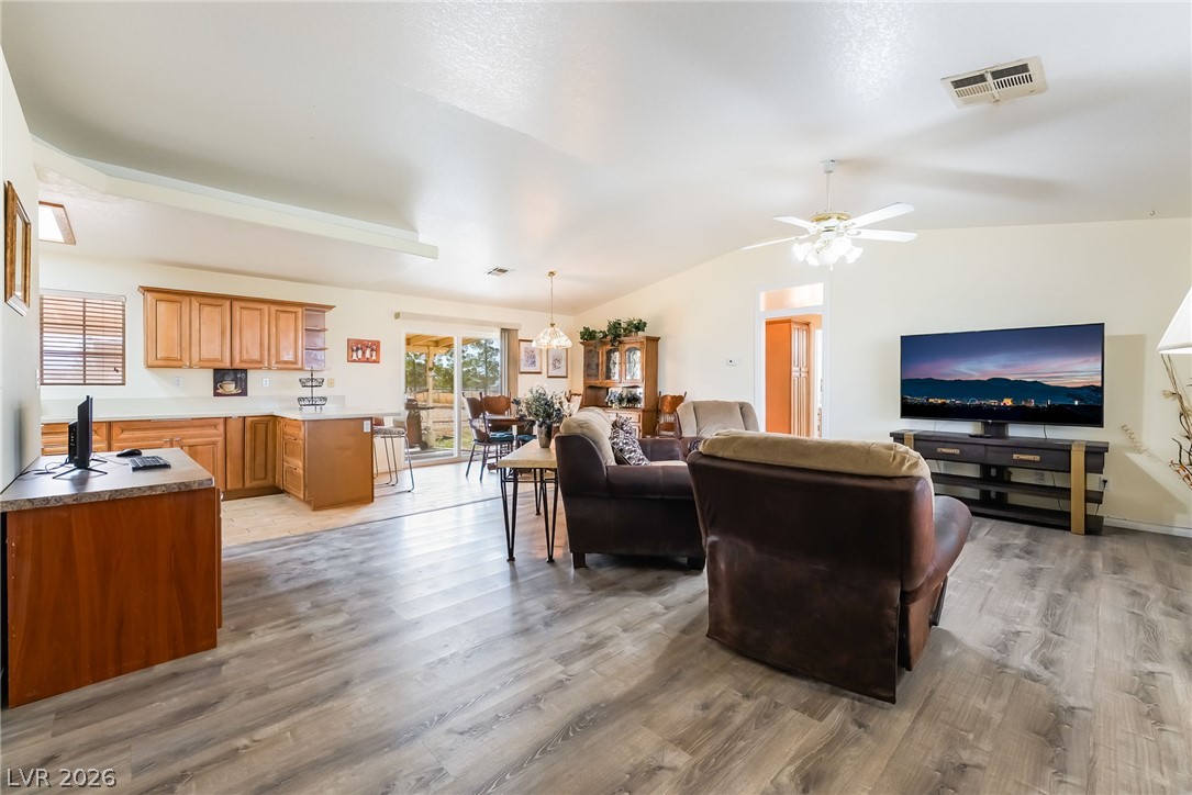 3631 South Blagg Road Pahrump, NV 89048 - Photo 7 of 47 An open concept living area features ample space, integrating a well-appointed kitchen, dining area, and comfortable lounge.