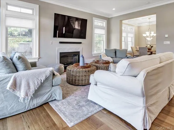 a living room with furniture fireplace and a flat screen tv