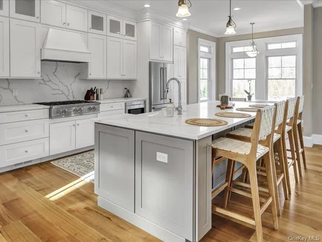 a kitchen with a sink window and cabinets