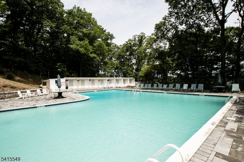 16 Troy Drive Springfield, NJ 07081 - Photo 13 of 15 a view of a swimming pool with a yard