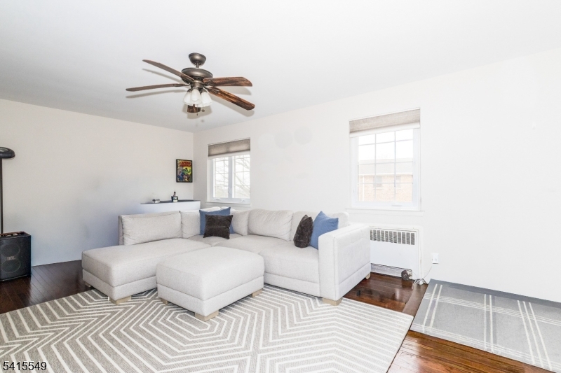 16 Troy Drive Springfield, NJ 07081 - Photo 6 of 15 a living room with furniture and a window