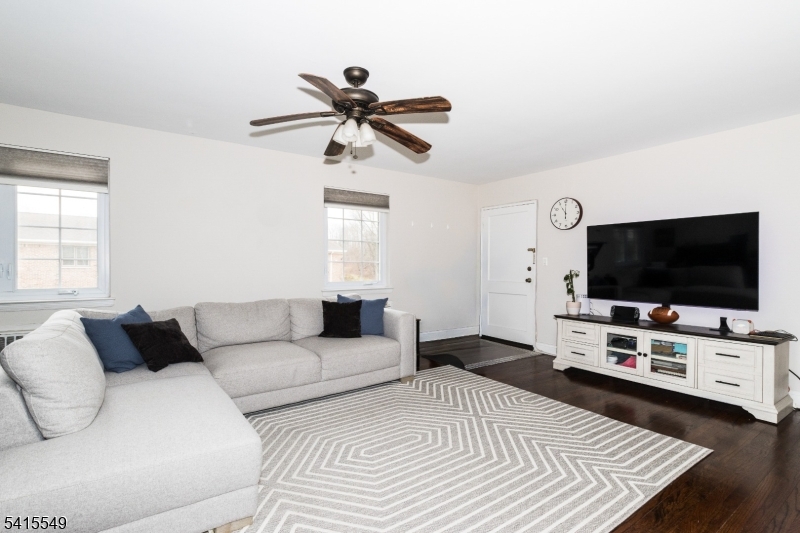 16 Troy Drive Springfield, NJ 07081 - Photo 7 of 15 a living room with furniture and a flat screen tv