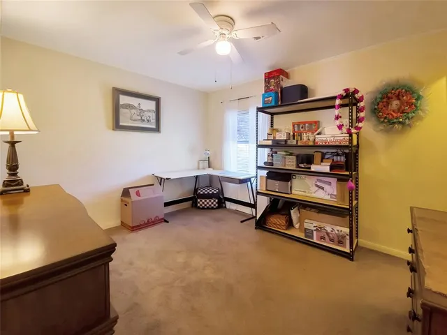 a bedroom with furniture and a window