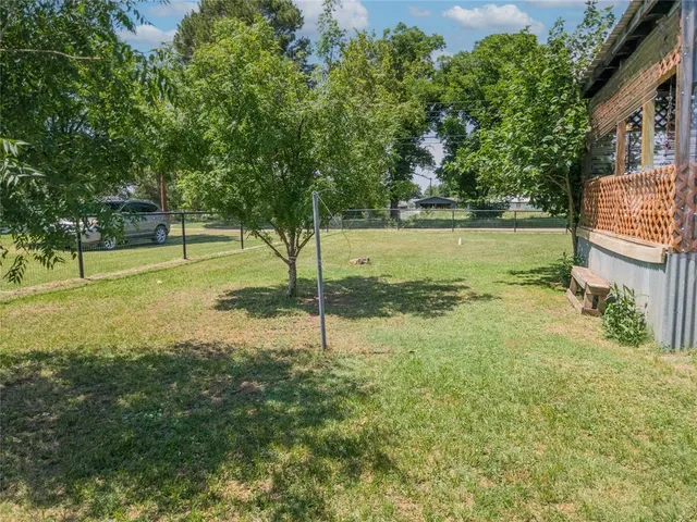 a view of a park with large trees