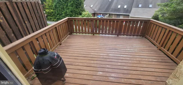 a view of deck with wooden floor and fence