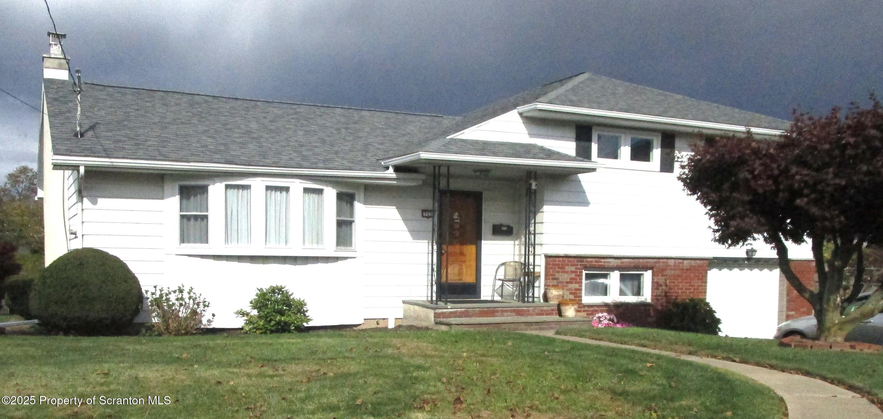 715 Moritz Street Dunmore, PA 18512 - Photo 1 of 14 a front view of a house with a yard