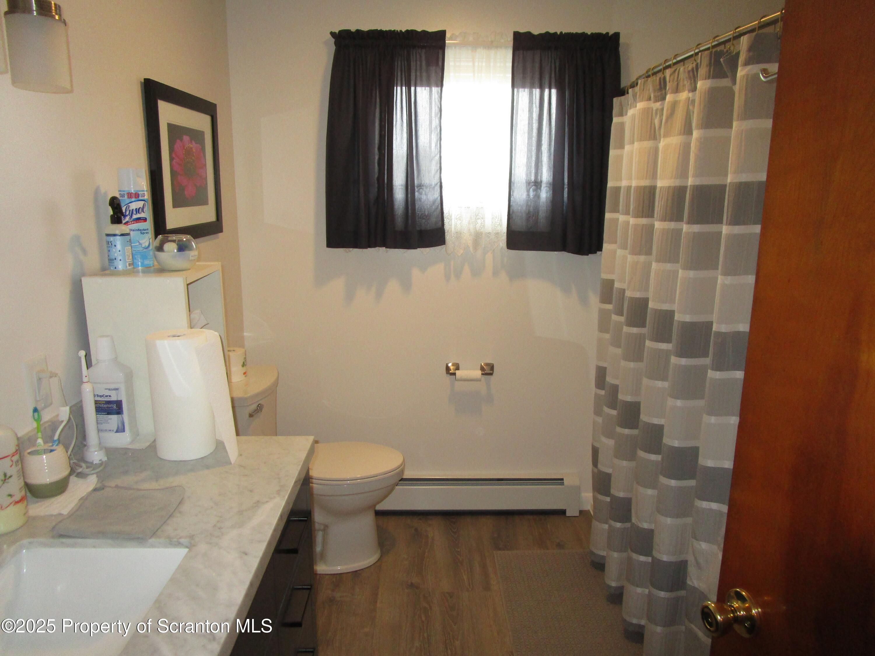 715 Moritz Street Dunmore, PA 18512 - Photo 6 of 14 a bathroom with a sink and a mirror