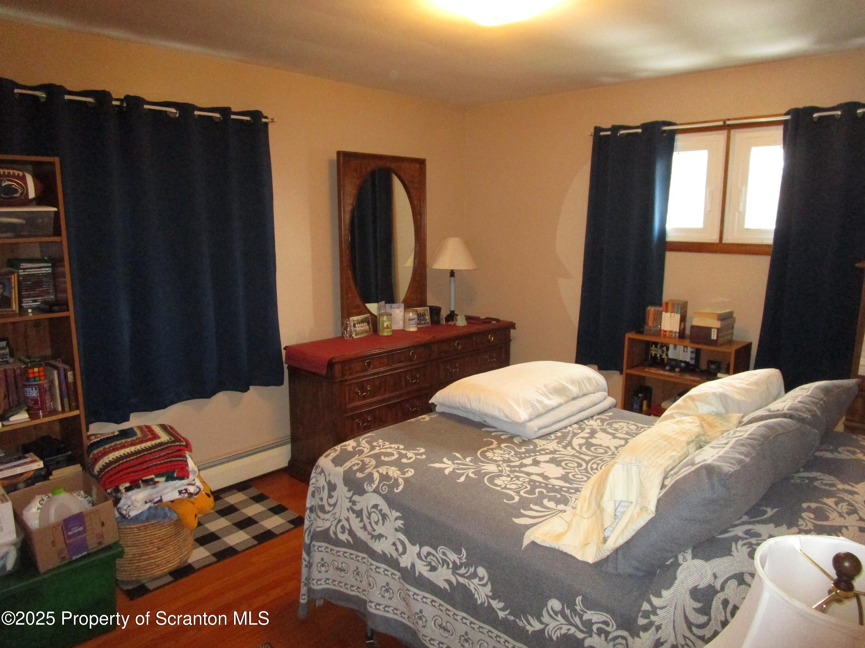 715 Moritz Street Dunmore, PA 18512 - Photo 8 of 14 a bedroom with two beds and a dresser
