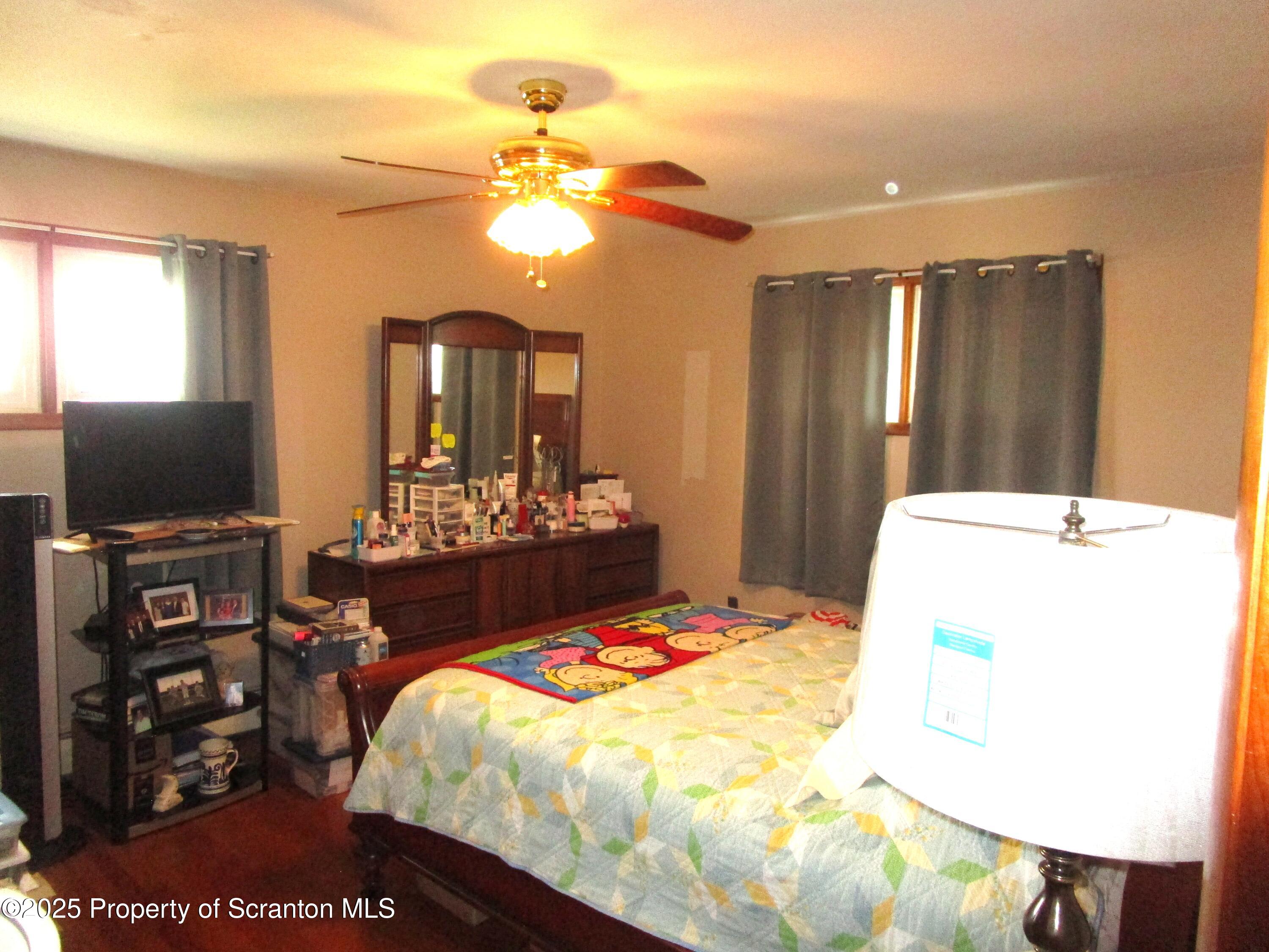 715 Moritz Street Dunmore, PA 18512 - Photo 9 of 14 a bedroom with a bed and a flat screen tv