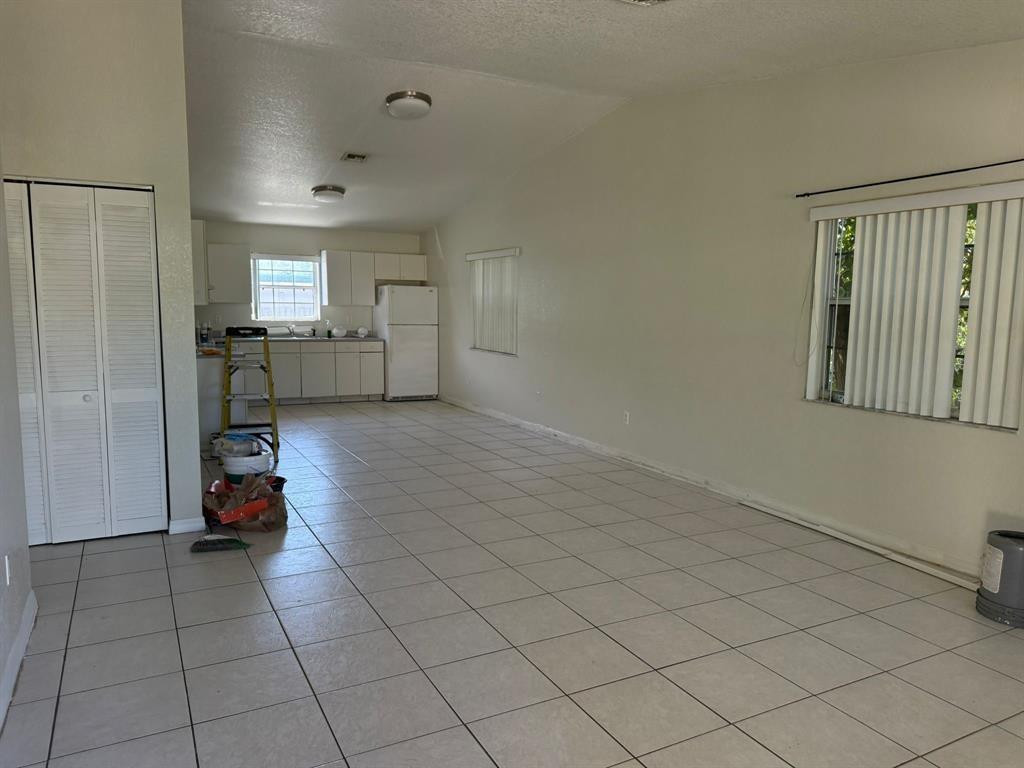 1943 Garfield Street Hollywood, FL 33020 - Photo 3 of 10 a view of a room with gym equipment and a large window