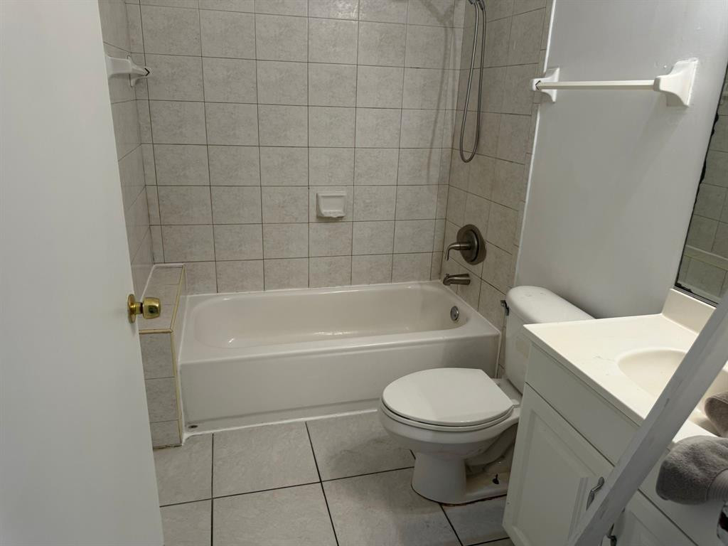 1943 Garfield Street Hollywood, FL 33020 - Photo 4 of 10 a bathroom with a toilet and a bath tub