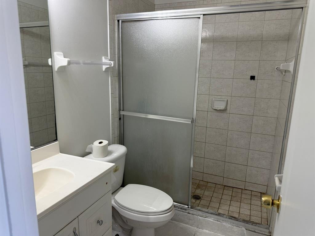 1943 Garfield Street Hollywood, FL 33020 - Photo 6 of 10 a bathroom with a shower a toilet and sink