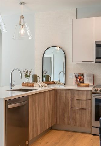 a kitchen with a sink and cabinets