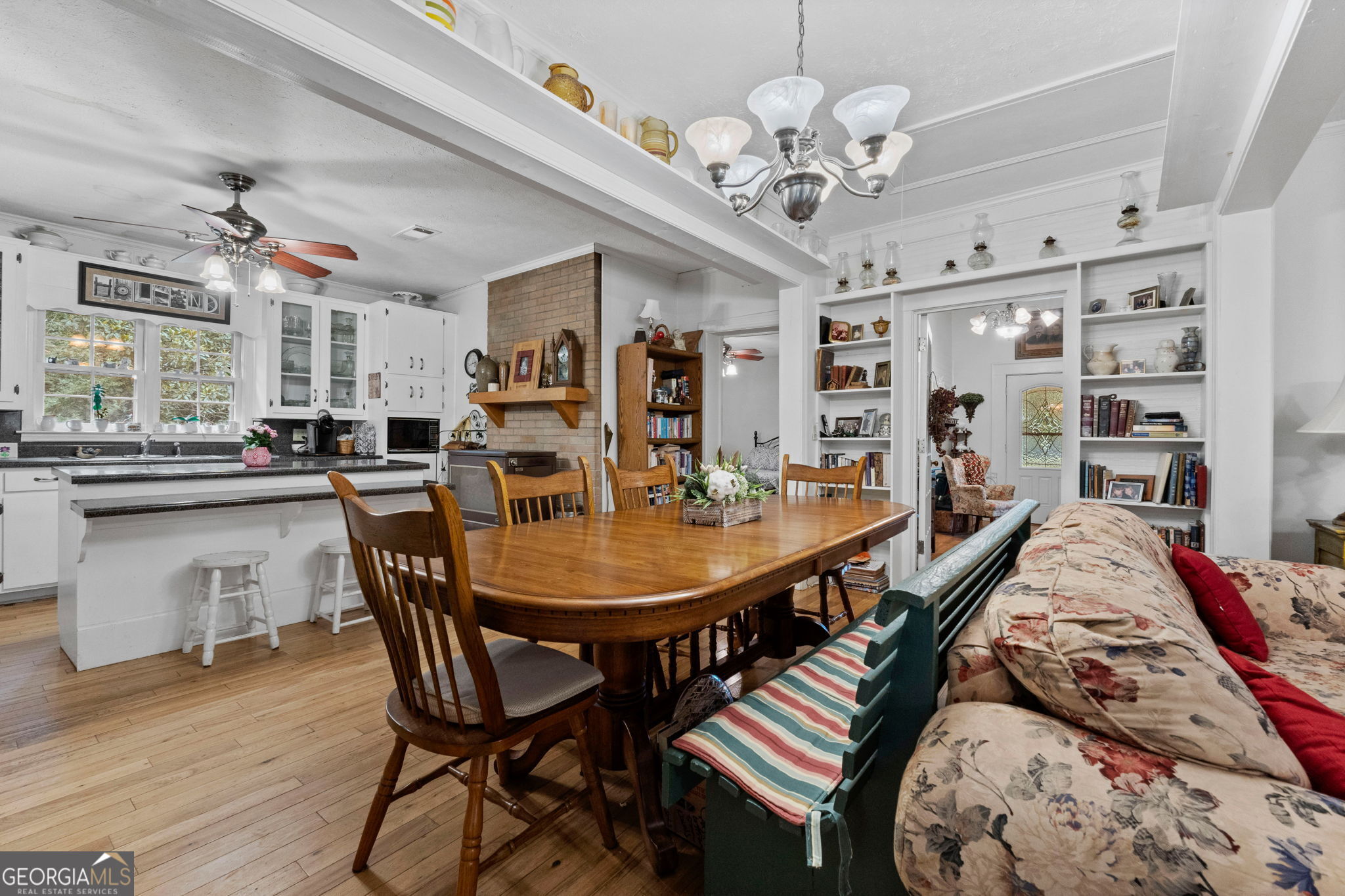 2037 Jeff Davis Road Thomaston, GA 30286 - Photo 12 of 60 a view of a dining room with furniture and a chandelier