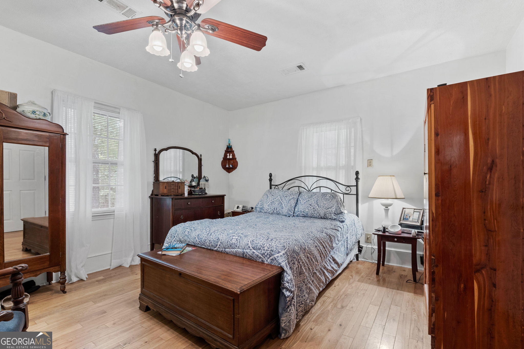 2037 Jeff Davis Road Thomaston, GA 30286 - Photo 16 of 60 a bedroom with a bed and a flat tv screen on dresser