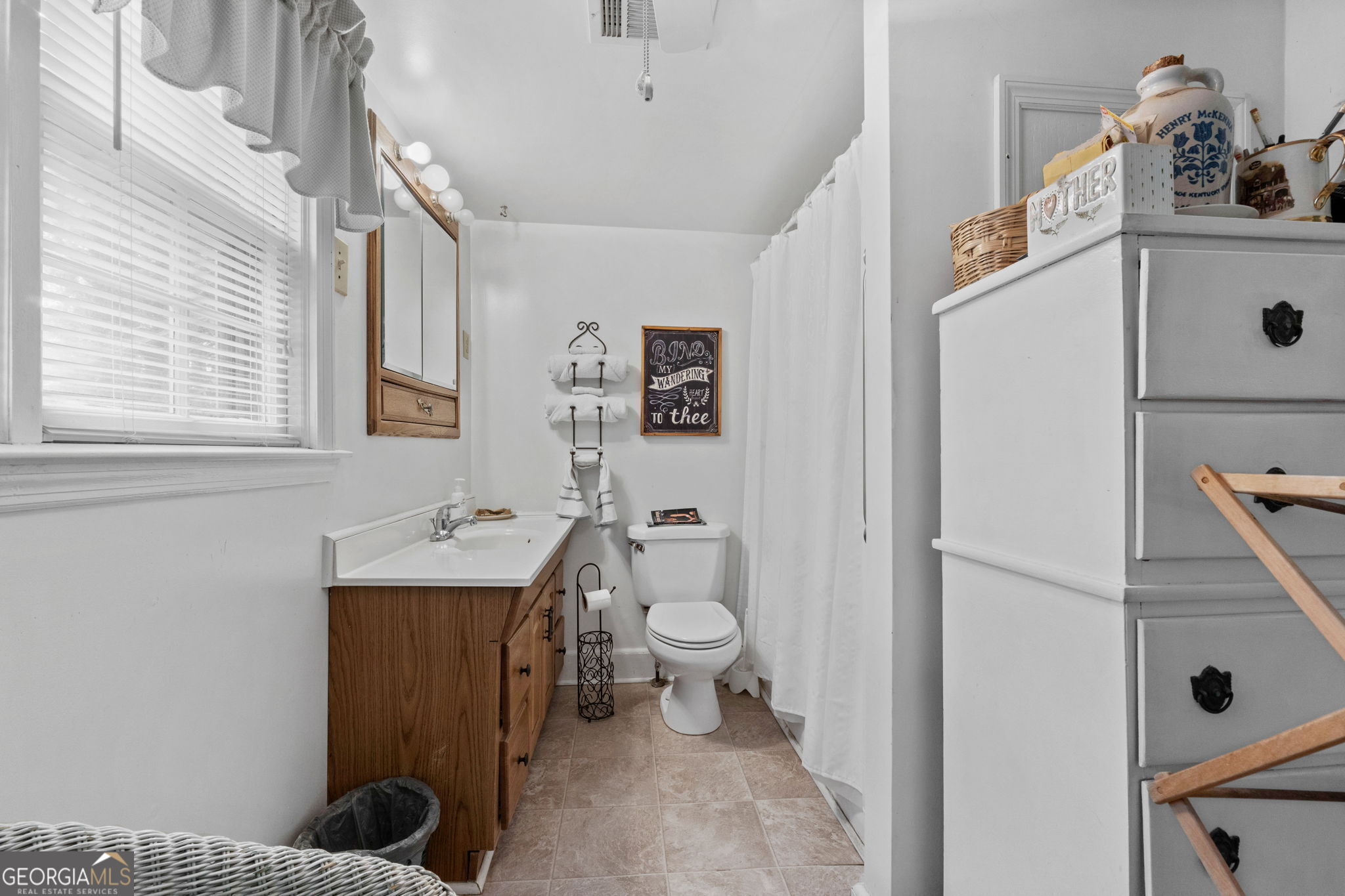 2037 Jeff Davis Road Thomaston, GA 30286 - Photo 21 of 60 a bathroom with a sink a toilet and shower