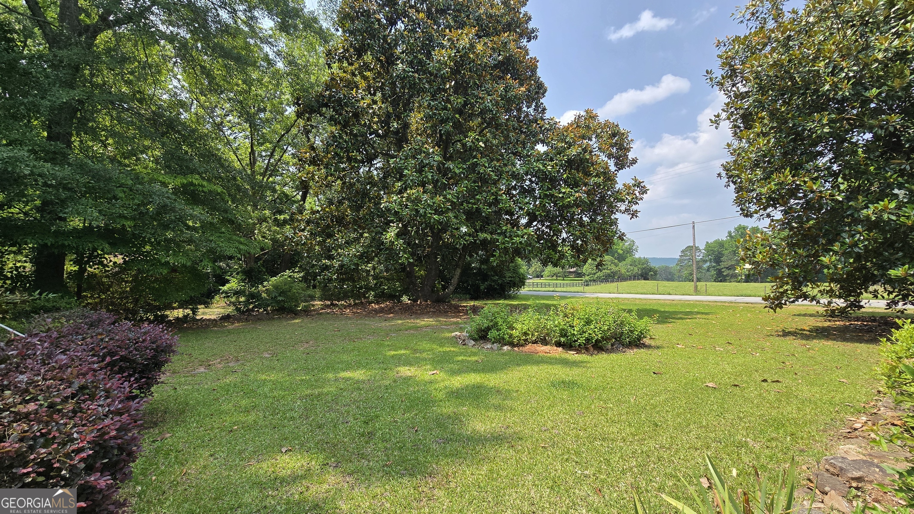 2037 Jeff Davis Road Thomaston, GA 30286 - Photo 42 of 60 a view of a golf course with a lake