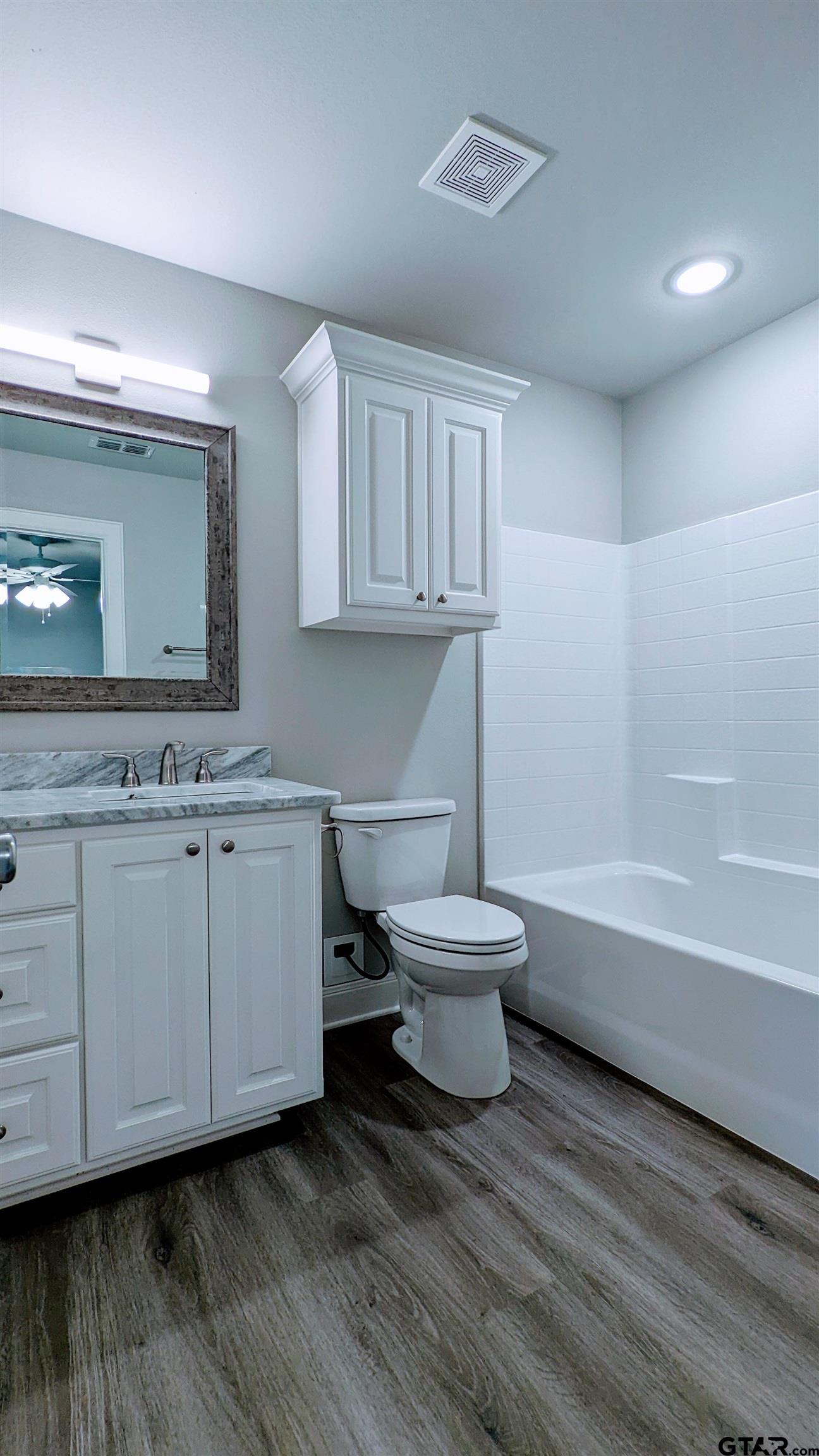 11672 Fm 2015, Unit B Tyler, TX 75708 - Photo 9 of 16 a bathroom with a sink and a mirror