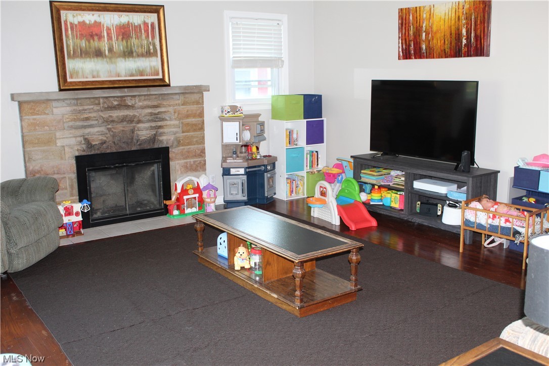 1810 Massillon Road Akron, OH 44312 - Photo 6 of 31 Hardwood floored living room with a fireplace