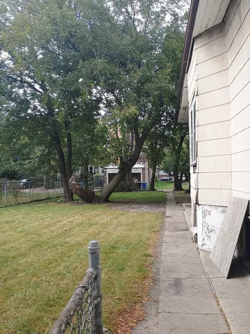 a view of a patio with a yard