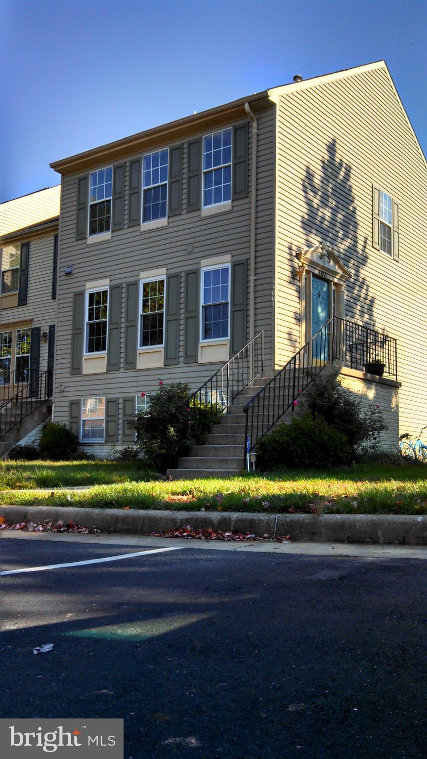 44001 Choptank Terrace Ashburn, VA 20147 - Photo 1 of 11 a front view of a house with a yard