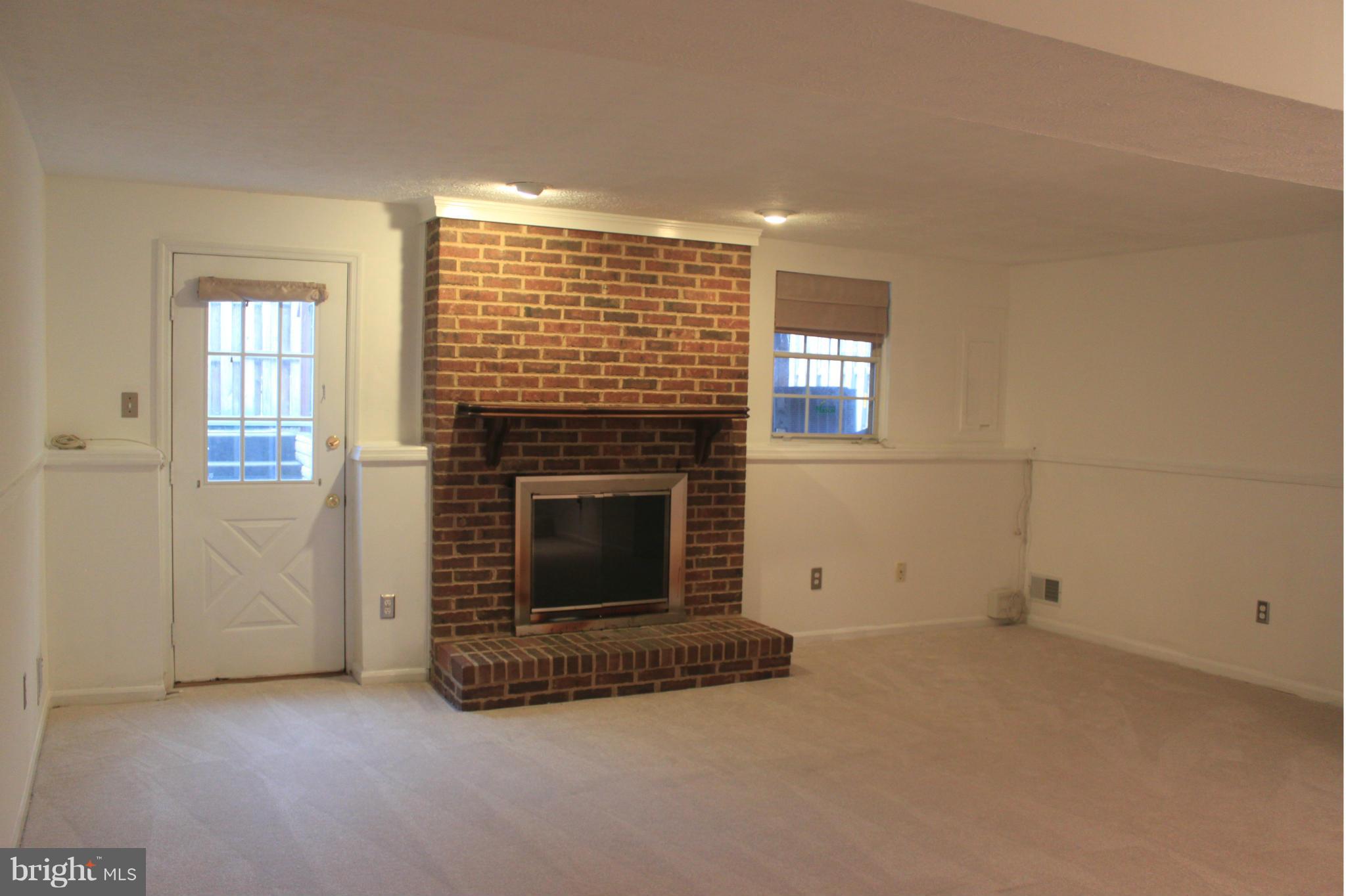 44001 Choptank Terrace Ashburn, VA 20147 - Photo 11 of 11 an empty room with windows and fireplace