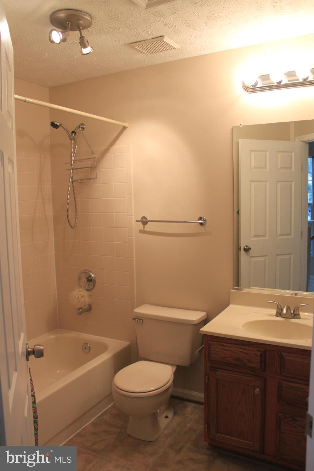 44001 Choptank Terrace Ashburn, VA 20147 - Photo 10 of 11 a bathroom with a sink a toilet and shower