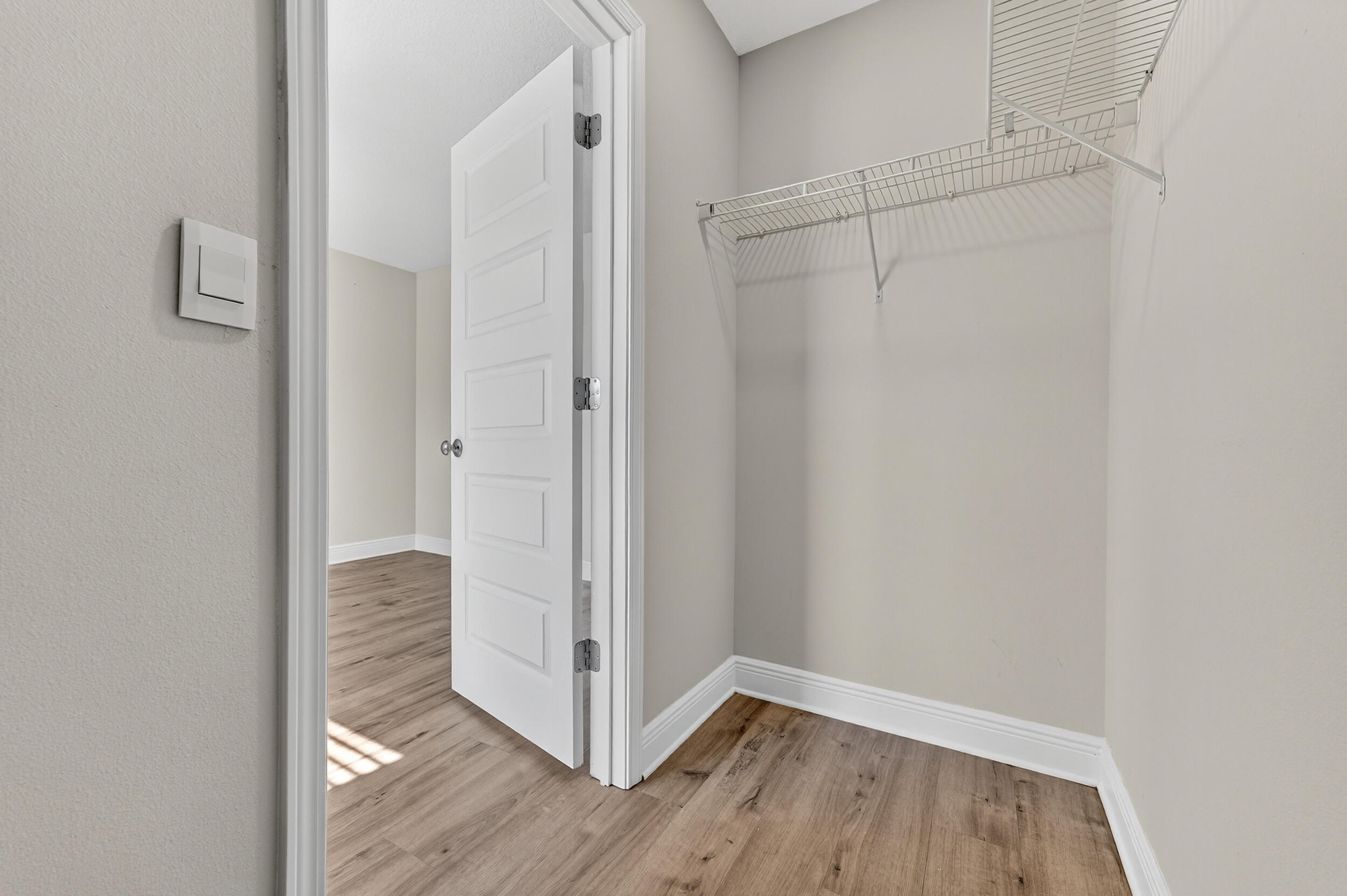 15 Redbird Loop Destin, FL 32541 - Photo 24 of 42 a view of an empty room with wooden floor