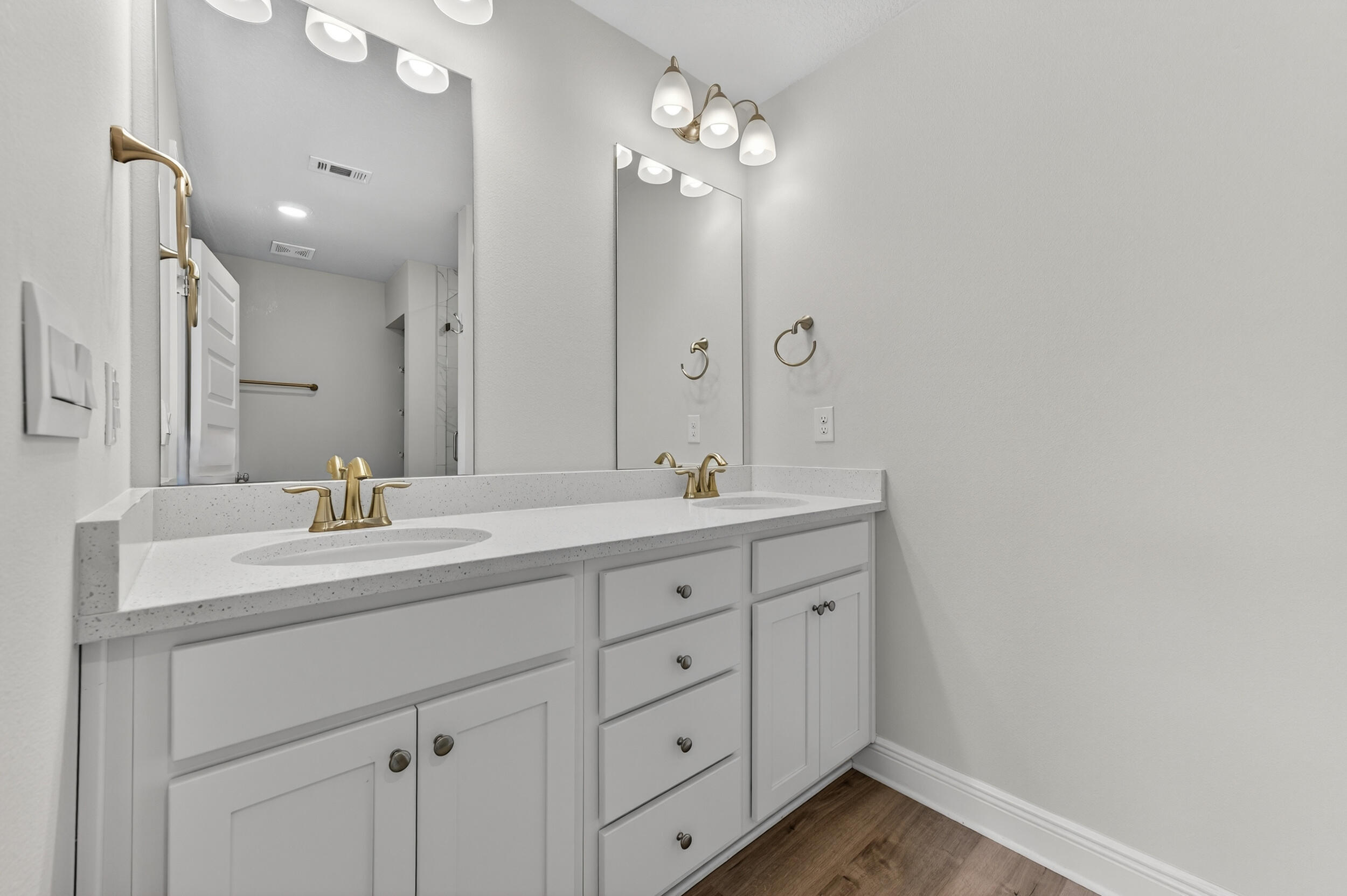 15 Redbird Loop Destin, FL 32541 - Photo 25 of 42 a bathroom with a double vanity sink and a mirror