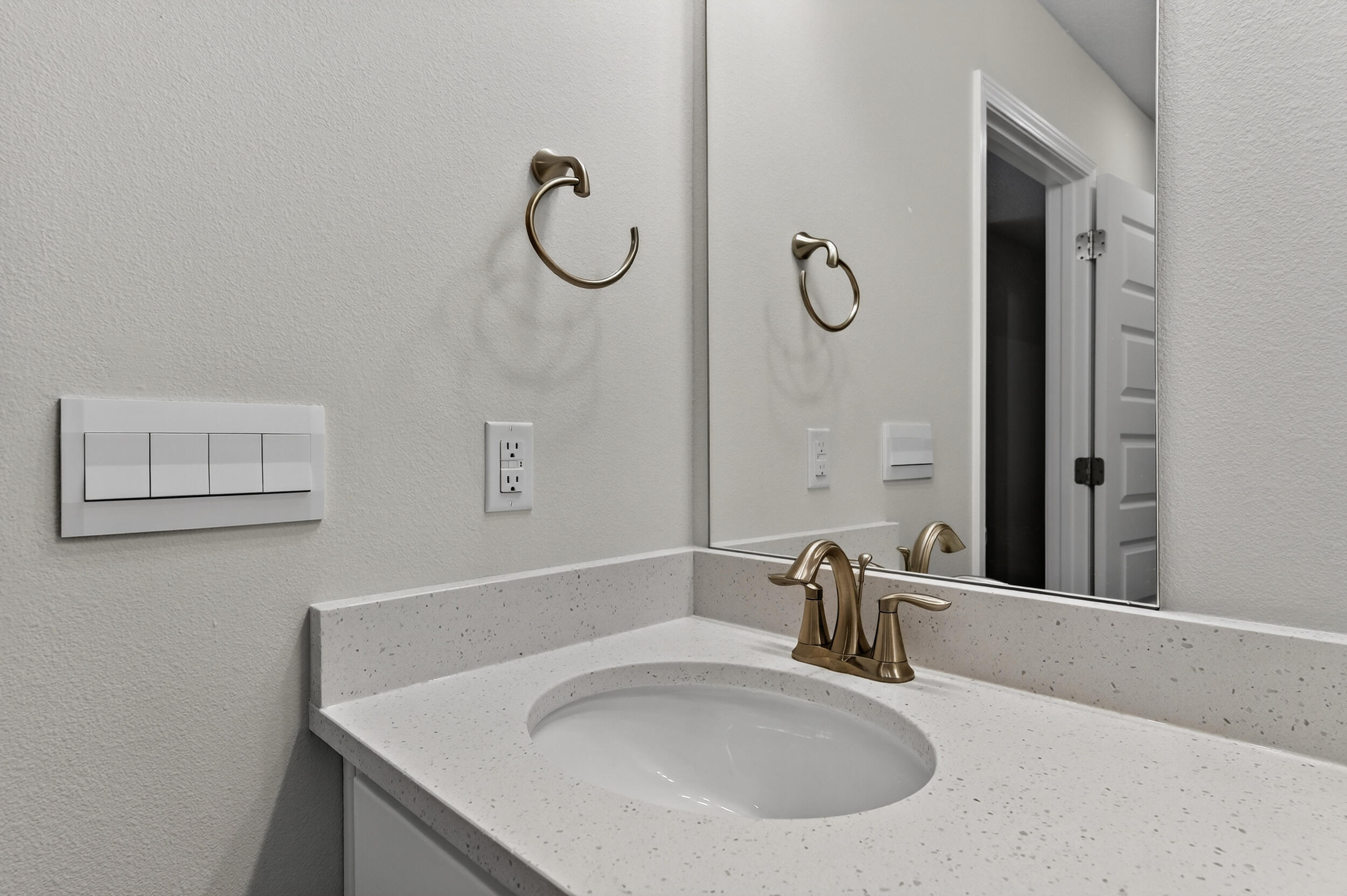 15 Redbird Loop Destin, FL 32541 - Photo 29 of 42 a bathroom with a sink and a mirror