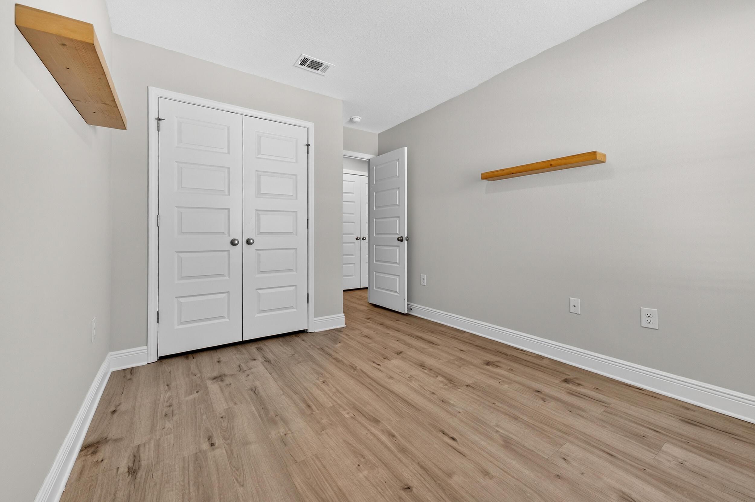 15 Redbird Loop Destin, FL 32541 - Photo 31 of 42 a view of an empty room with wooden floor