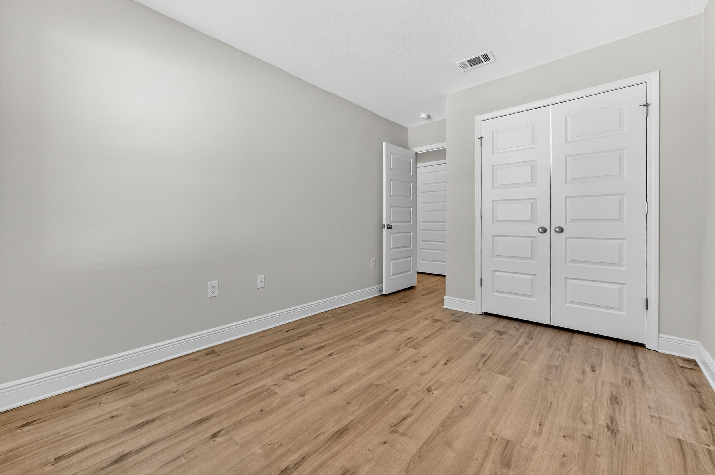 15 Redbird Loop Destin, FL 32541 - Photo 33 of 42 a view of an empty room with wooden floor