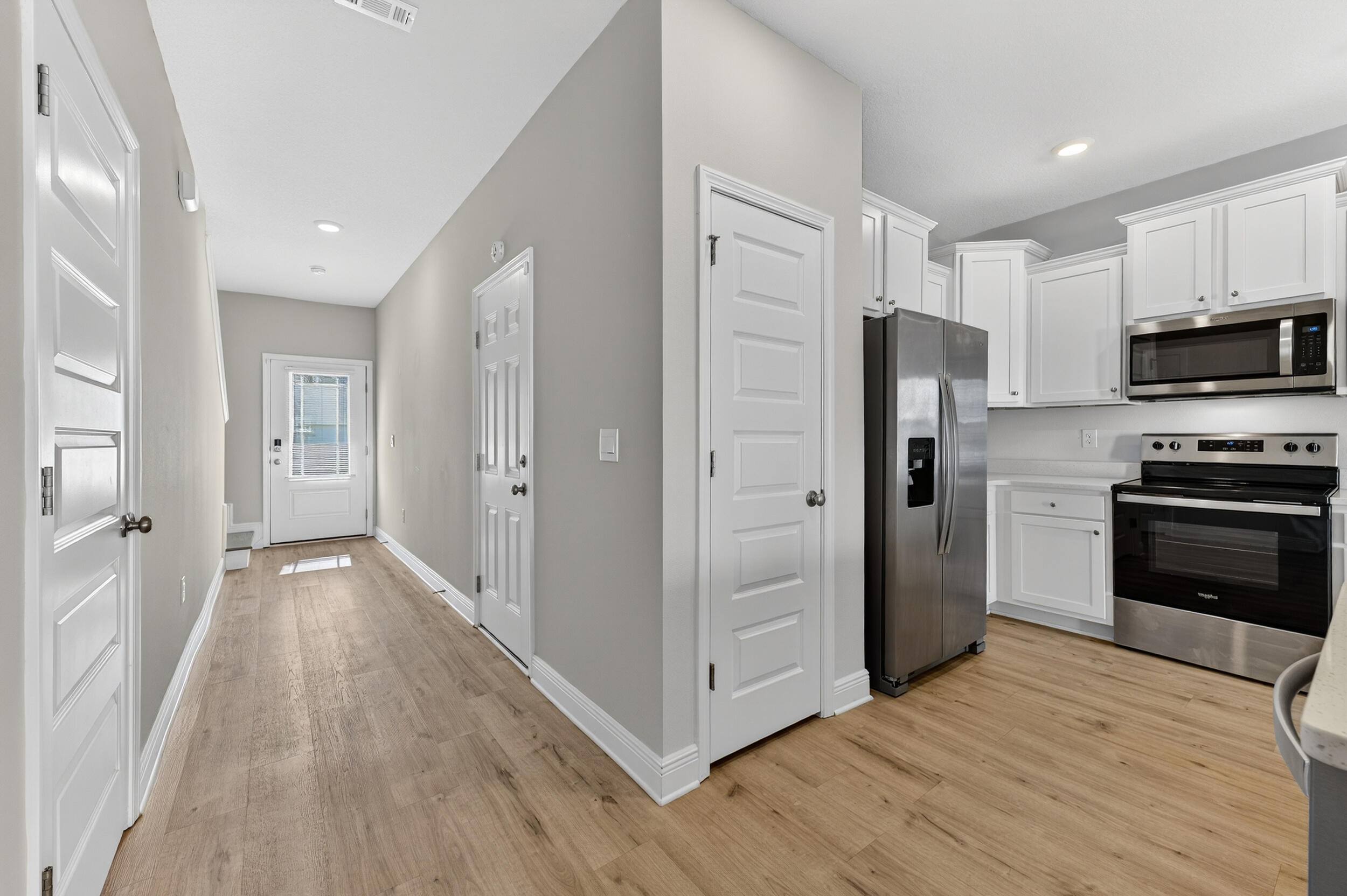 15 Redbird Loop Destin, FL 32541 - Photo 4 of 42 a view of a kitchen with wooden floor and electronic appliances